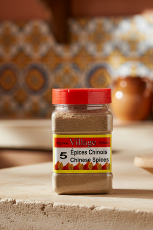 A jar of Village Spices 5 Chinese Spices, with a red lid and a label displaying the product name and weight.